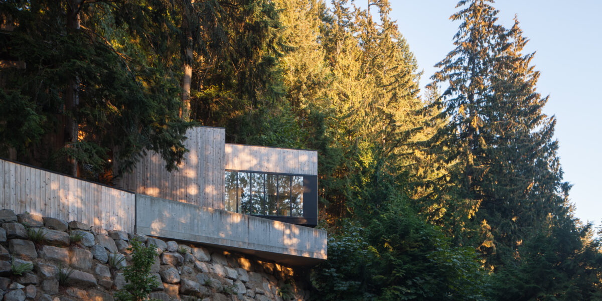 Contemporary home in Lions Bay with cedar siding and rooftop deck among trees