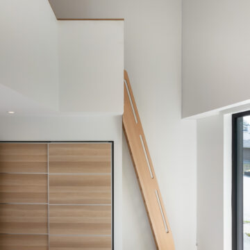 North Vancouver Renovation of Kid's Bedroom Custom Closet Doors and Loft Ladder Charming children's bedroom featuring a loft-access ladder to play area.
